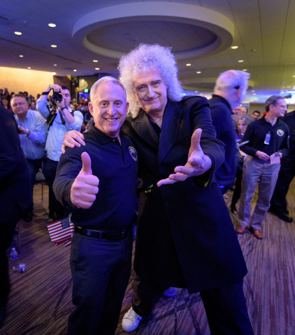 New Horizons principal investigator Alan Stern poses with astrophysicist and Queen lead guitarist Brian May on Dec. 31, 2018 at Johns Hopkins' Applied Physics Laboratory in Maryland just before New Horizons flew by Ultima Thule. <cite>NASA/Bill Ingalls</cite>